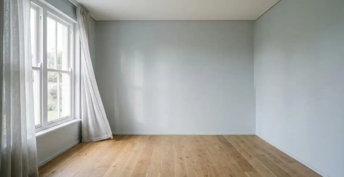 Peaceful empty nursery room with freshly painted walls showing soft morning light through window with air circulation